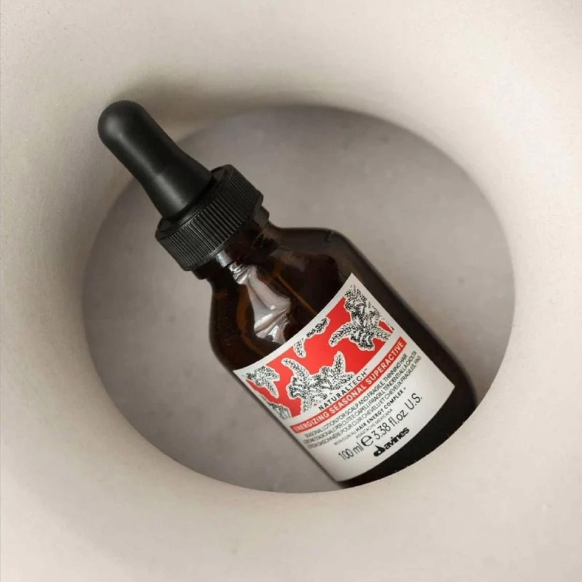 Davines label closeup highlighting ingredients and sustainable certifications benefit