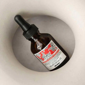 Davines label closeup highlighting ingredients and sustainable certifications benefit