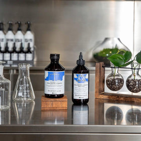 Davines label close-up showing ingredient list and brand commitment