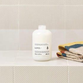 Davines co-wash being poured into hand for easy application benefit
