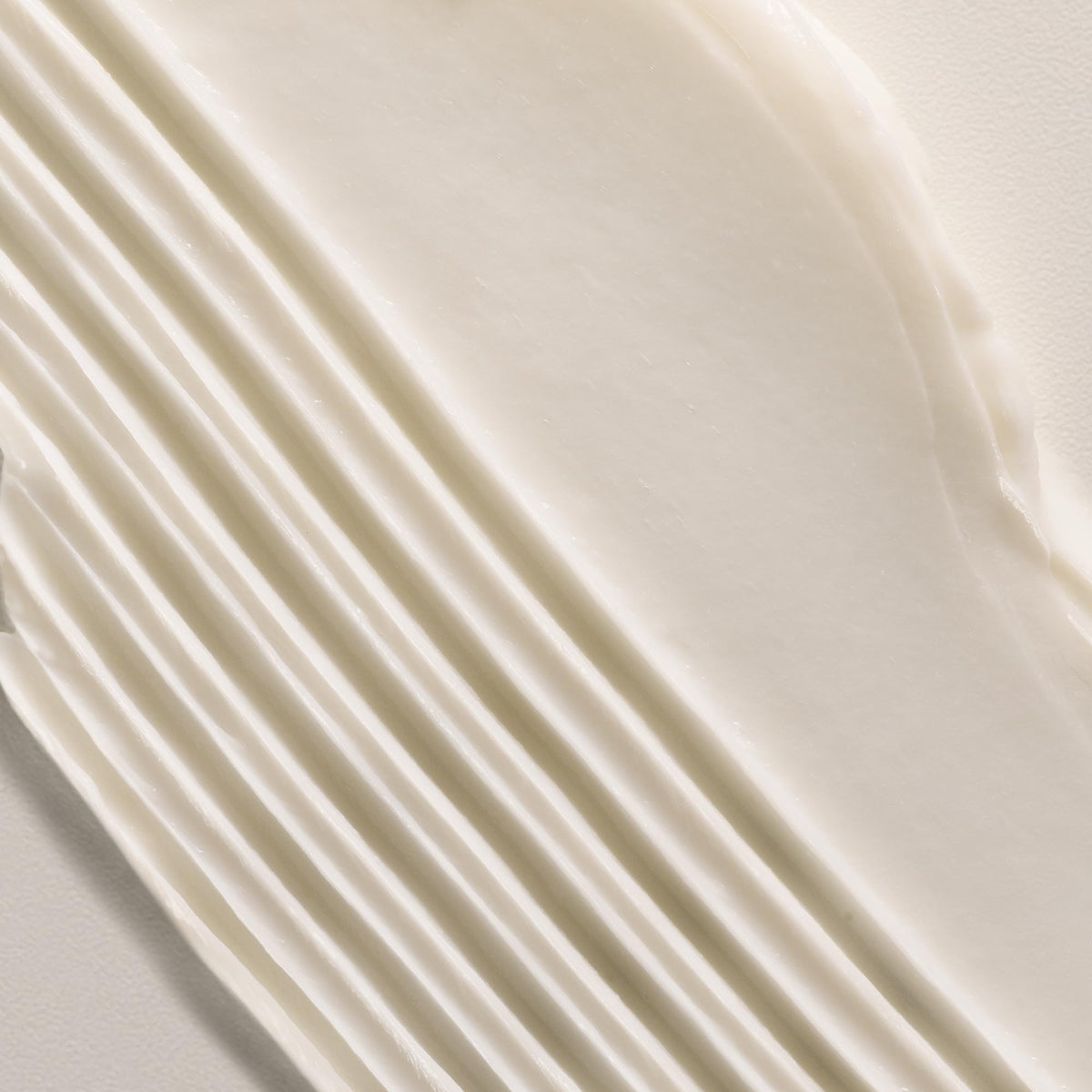 Davines LOVE Curl Conditioner texture close-up showing creamy slip for detangling