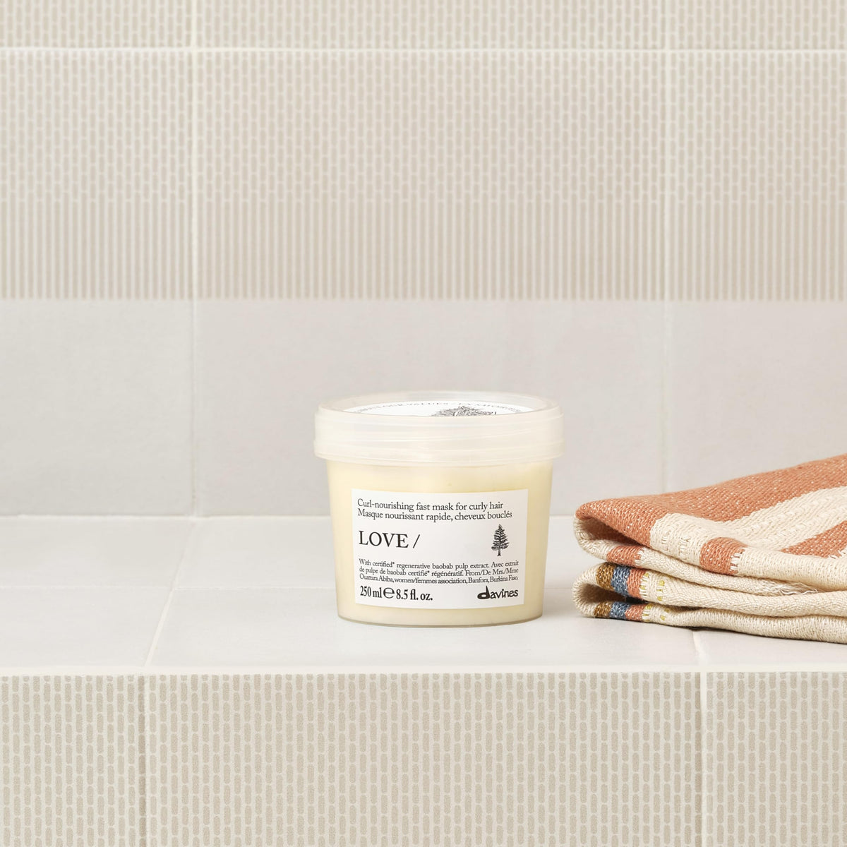Davines LOVE CURL mask swatch on hand showing rich feel and fast absorption benefit