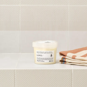 Davines LOVE CURL mask swatch on hand showing rich feel and fast absorption benefit