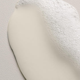 Davines bottle in bathroom setting demonstrating daily curl care