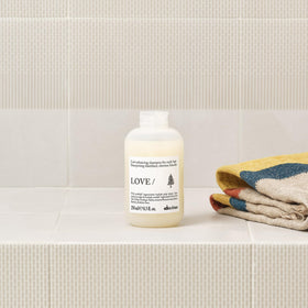 Davines product staged on shelf with styling props for routine inspiration