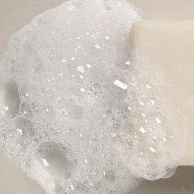 Davines LOVE SMOOTHING inside a travel case showing spill-free portability and convenience