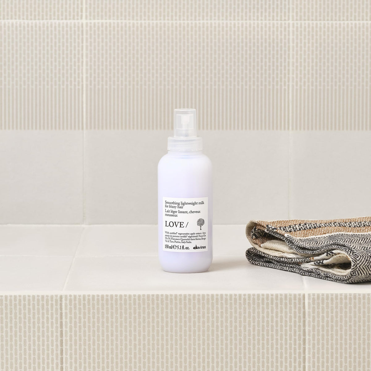 Davines spray applied to damp hair demonstrating easier styling and protection
