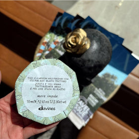 Davines label close-up showing ingredient details and sustainable branding
