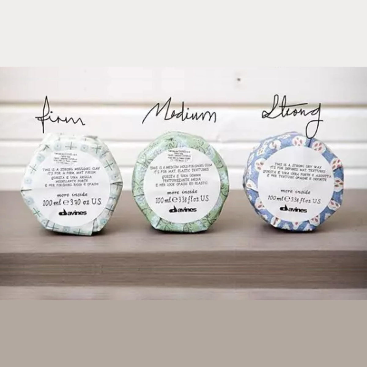 Davines jar next to ruler showing 2.54 fl oz size and compact portability