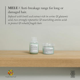 Davines MELU travel size bottle held in hand showing portable convenience