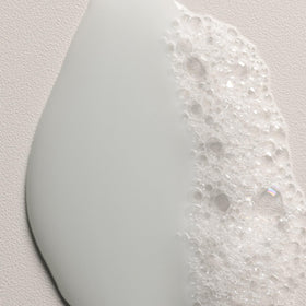 Davines MINU caper blossom ingredient close-up showing antioxidant benefit
