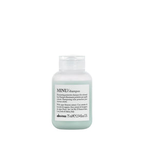 Davines MINU front bottle showing compact travel design and color protection
