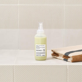 Davines MOMO dispensing pump releasing serum for controlled application and less waste
