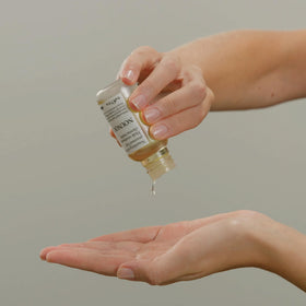 Davines NOUNOU texture on hands showing lightweight absorption and non-greasy finish