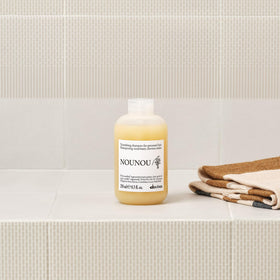 Davines NOUNOU foam texture close-up showing gentle cleansing action