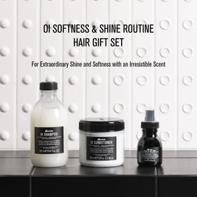 Davines OI conditioner texture close-up showing creamy slip for detangling benefit
