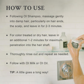 Davines OI conditioner pouring from bottle to show silky consistency