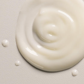 Davines OI ingredients label closeup showing roucou and sunflower oil