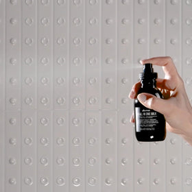 Davines OI set styled on bathroom vanity conveying salon-scented at-home ritual