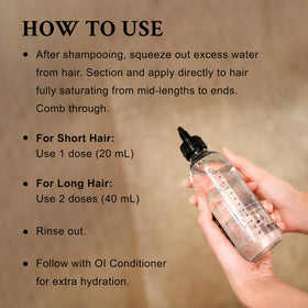 Davines OI Liquid Luster in hand demonstrating bottle size and travel-friendly benefit