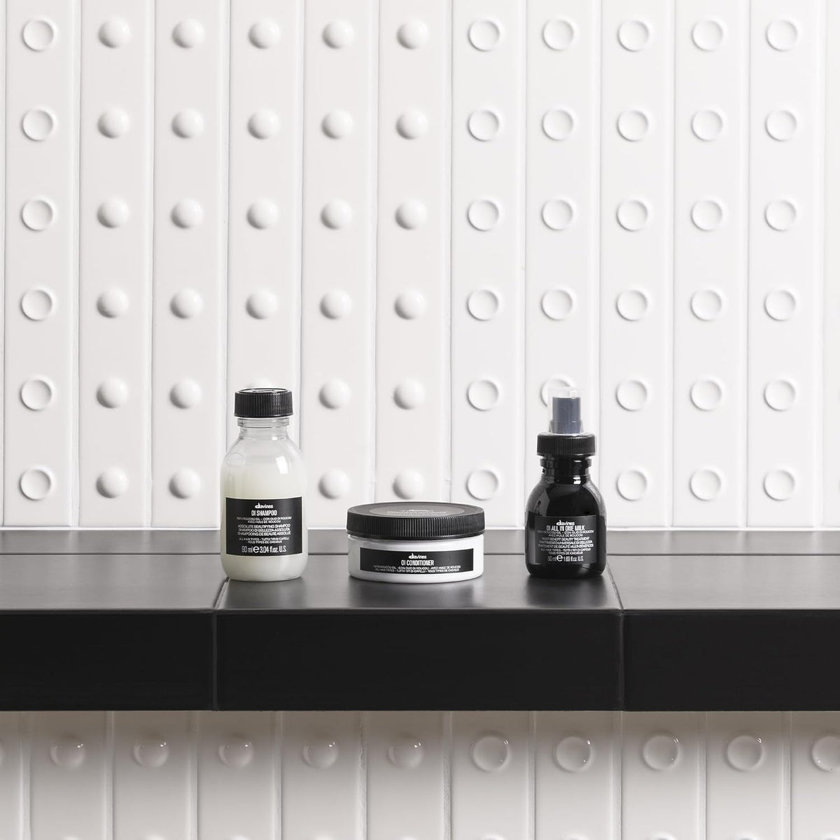 Davines OI milk applied to towel-dried hair for detangling benefit