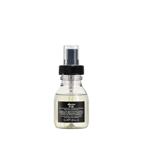 Davines OI Oil front bottle showing travel-size packaging and brand benefit