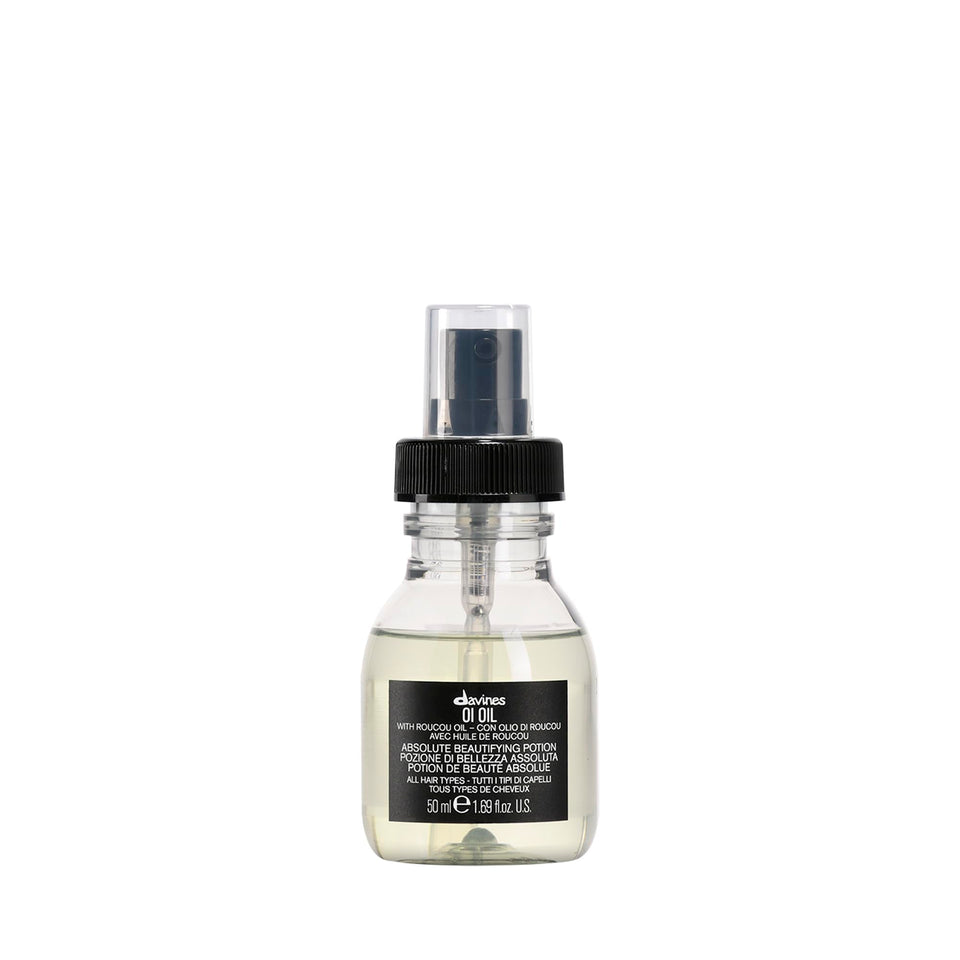 Davines OI Oil front bottle showing travel-size packaging and brand benefit