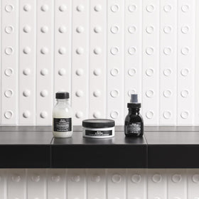 Davines OI shampoo lather on hair indicating gentle cleansing and shine