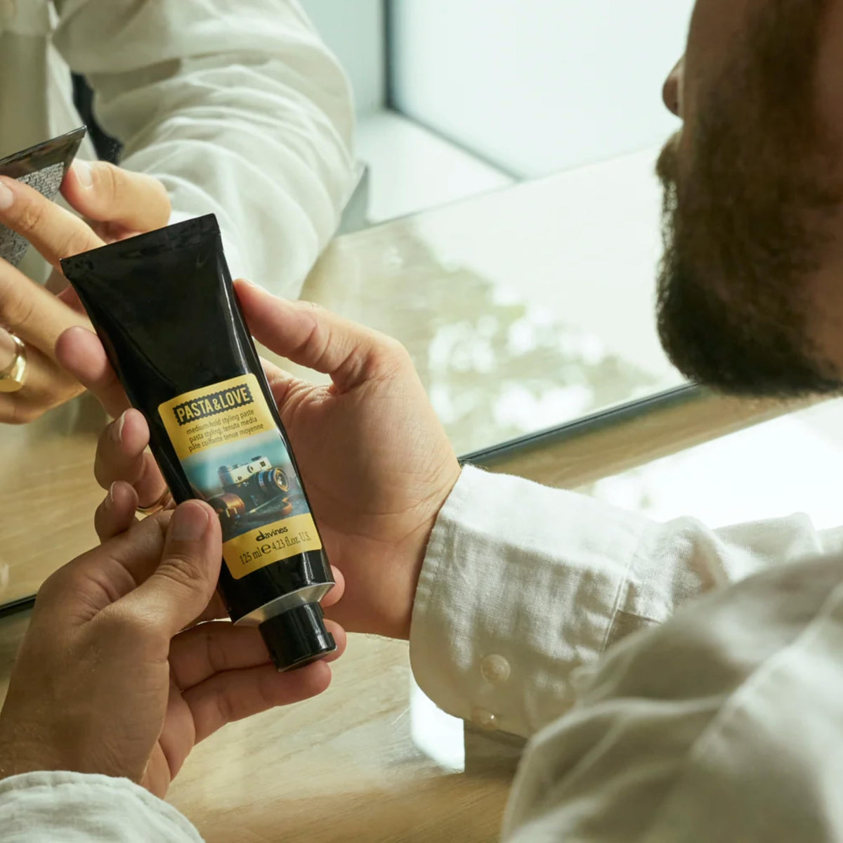 Davines paste being worked into hair demonstrating easy styling benefit