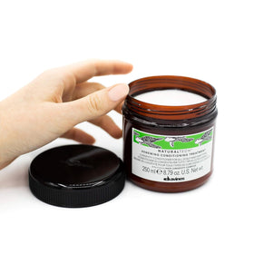 Davines small dispensed amount on hand illustrating concentrated formula