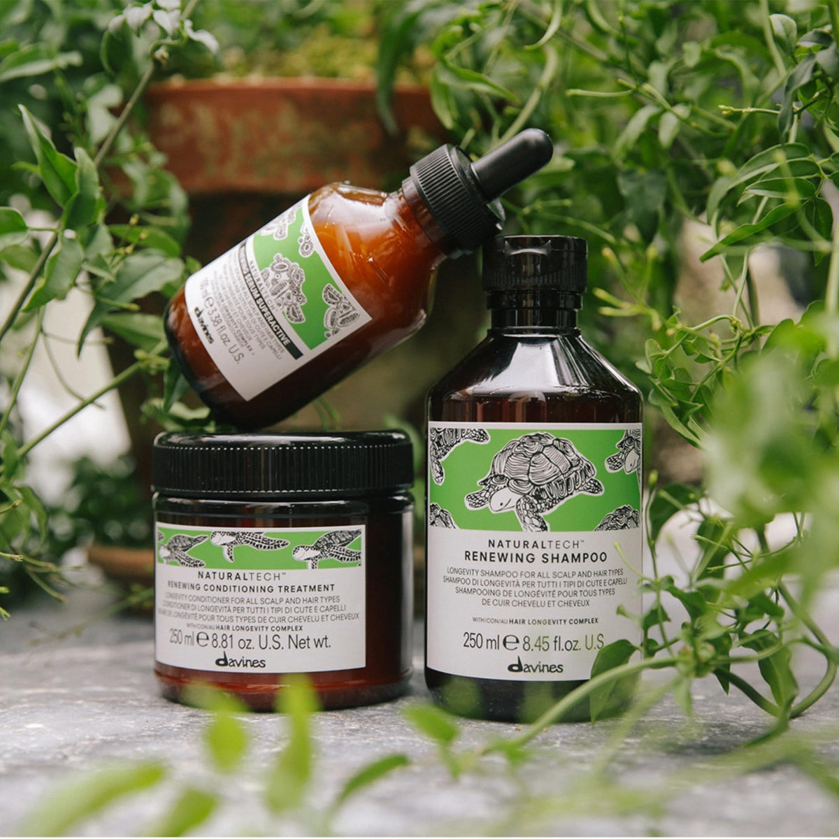 Davines bottle next to ruler showing 8.45 fl oz size and scale