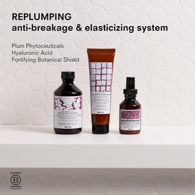 Davines replumping shampoo in shower use demonstrating gentle cleansing action