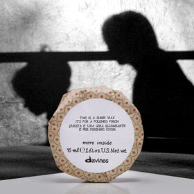 Davines shine wax polishing an updo highlighting smooth, controlled look benefit