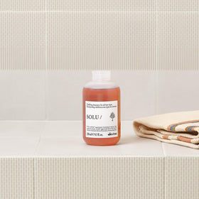 Davines SOLU label with buckwheat ingredient highlighted for protective benefits