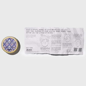 Davines wax texture in open jar showing dry, workable fibers benefit