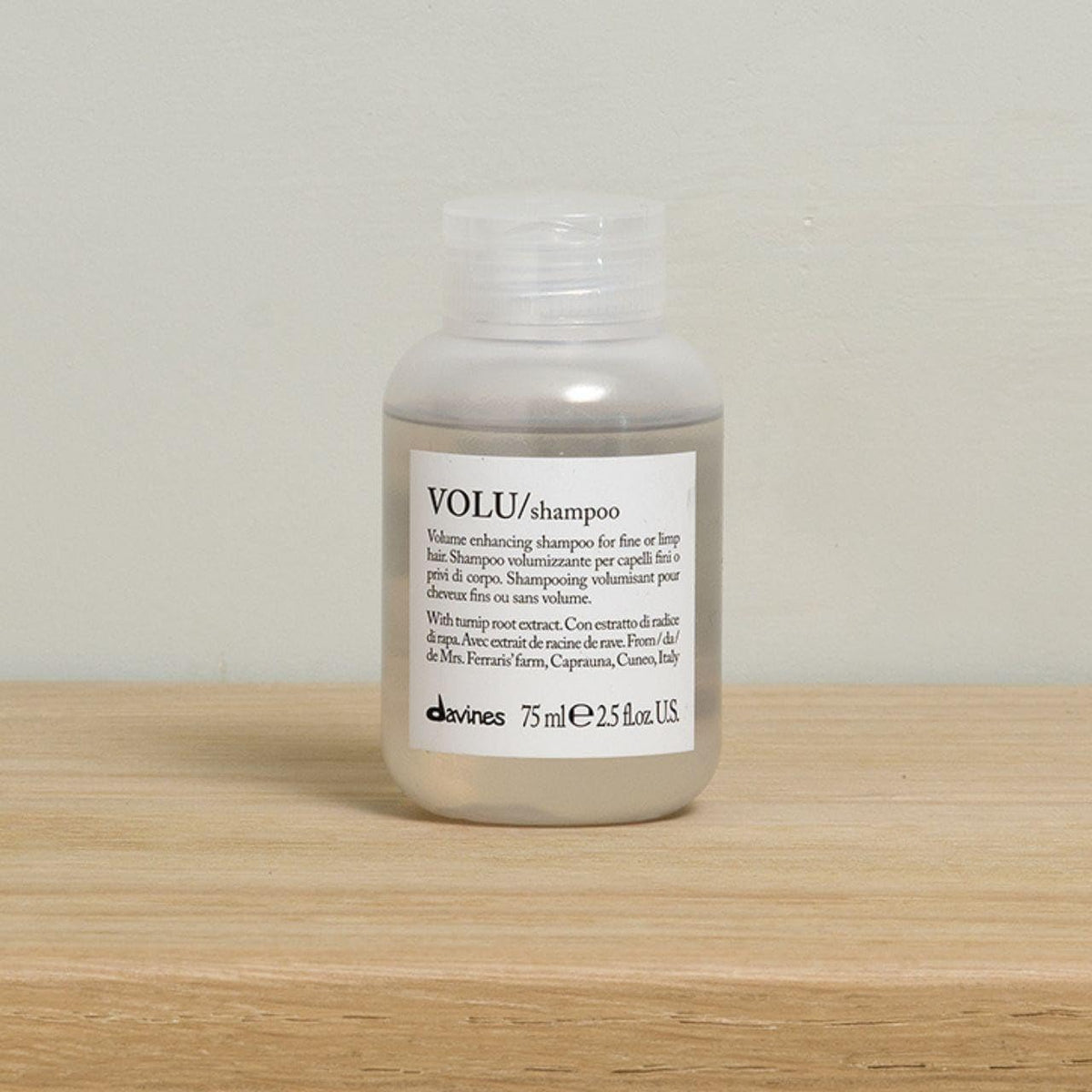 Davines VOLU bottle cap detail demonstrating secure travel closure