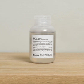 Davines VOLU bottle cap detail demonstrating secure travel closure