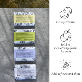 Davines VOLU shampoo bar held in hand showing compact size and travel convenience