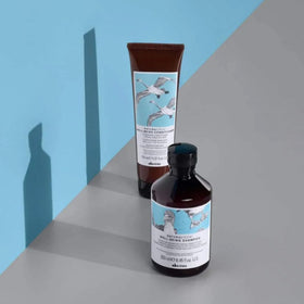 Davines product on bathroom shelf in lifestyle scene promoting routine use