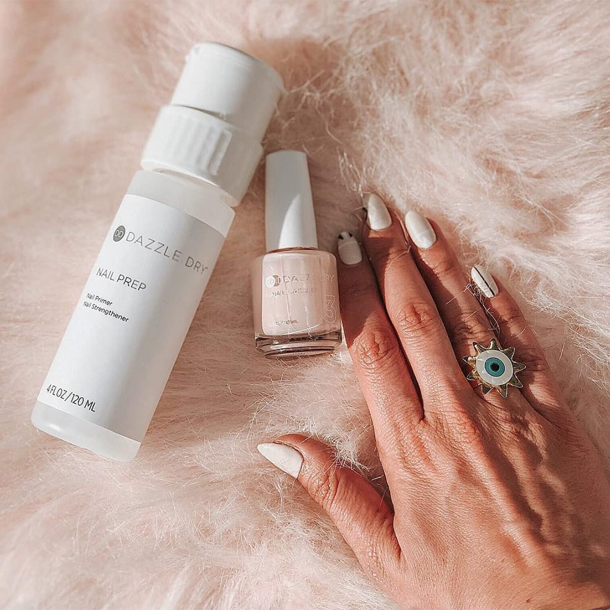 Dazzle Dry application on hands demonstrating quick five-minute dry