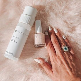 Dazzle Dry application on hands demonstrating quick five-minute dry
