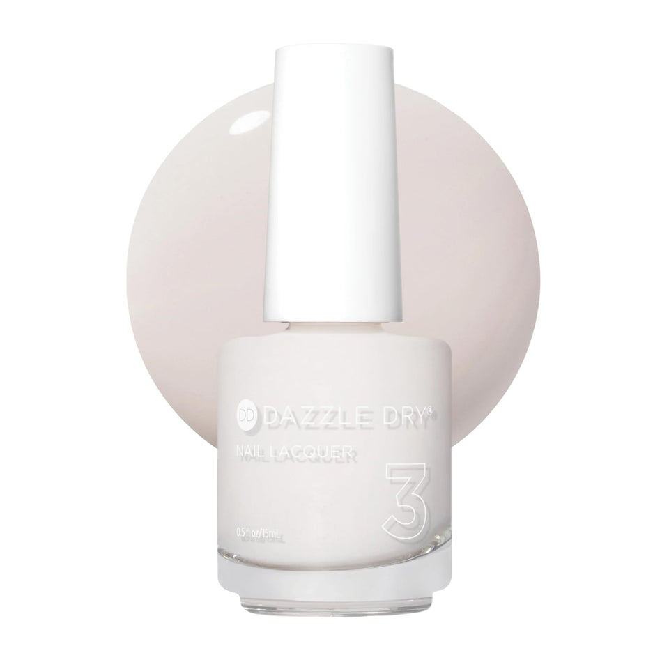 Dazzle Dry bottle front showing pale off-white cream shade and brand