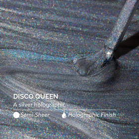 Dazzle Dry swatch on nail tip revealing holographic sparkle and buildable coverage