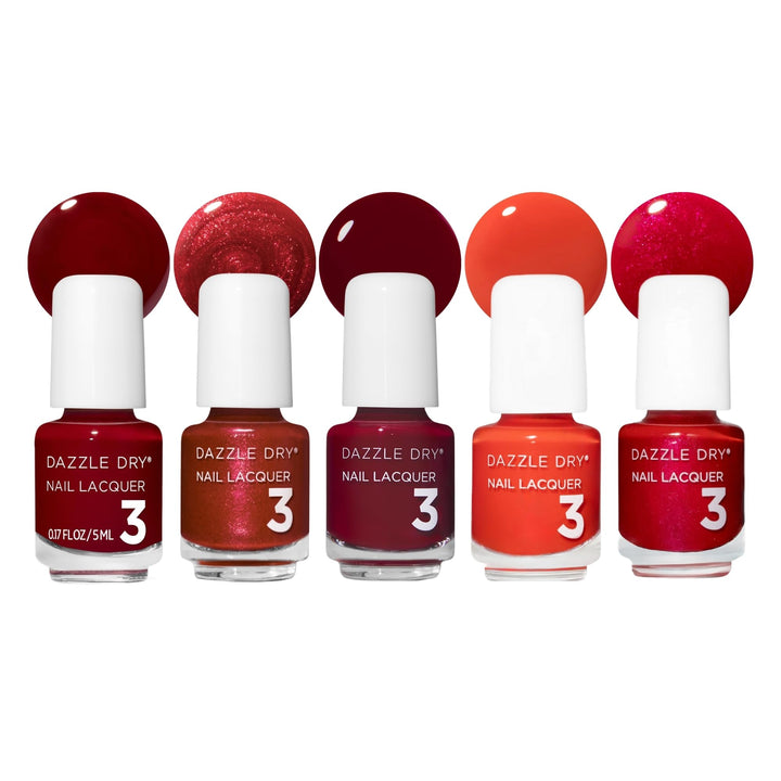 Dazzle Dry front packaging showing five mini red lacquers and compact case benefit travel-ready