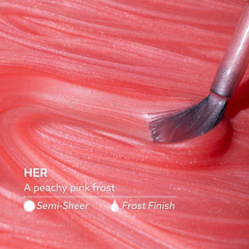 Dazzle Dry swatch on a nail wheel demonstrating Her peachy-pink frost color and layering options