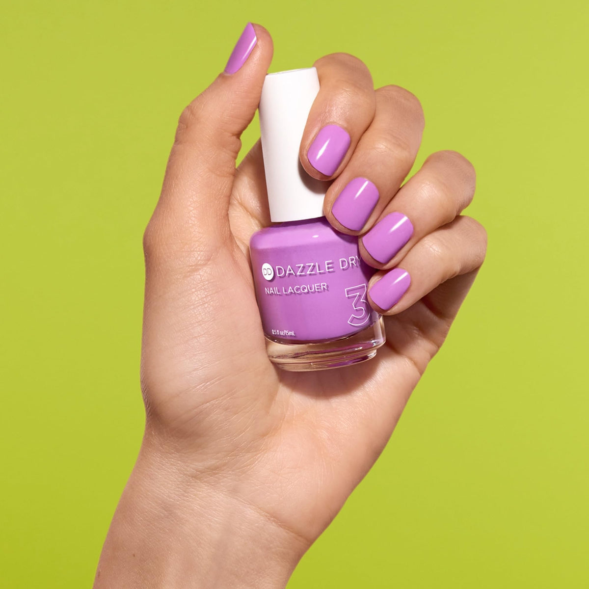 Dazzle Dry swatch on nail wheels showing vibrant orchid shade and consistency