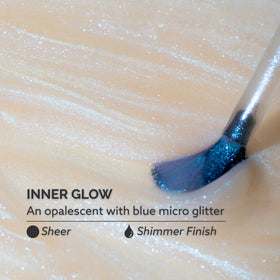 Close-up of Inner Glow blue micro-glitter showing Dazzle Dry luminous sparkle benefit