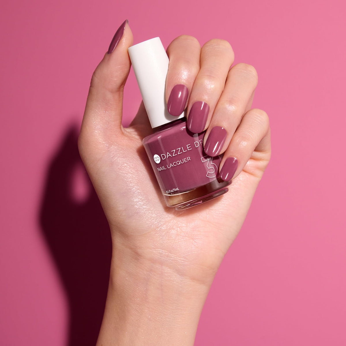Manicure with Dazzle Dry polish in use displaying salon-quality finish at home