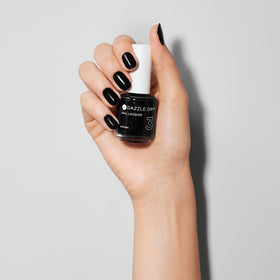 Dazzle Dry polish swatch on nail wheel demonstrating deep black opacity benefit