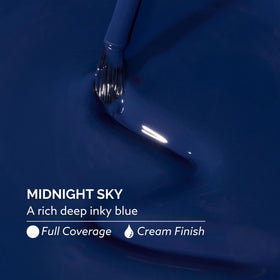 Dazzle Dry swatch on fingers displaying rich inky blue color and full coverage